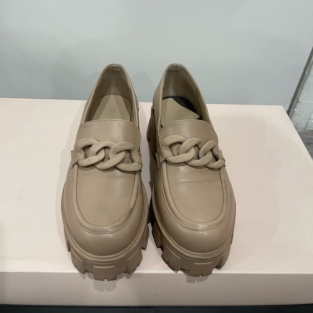Tan leather loafers.